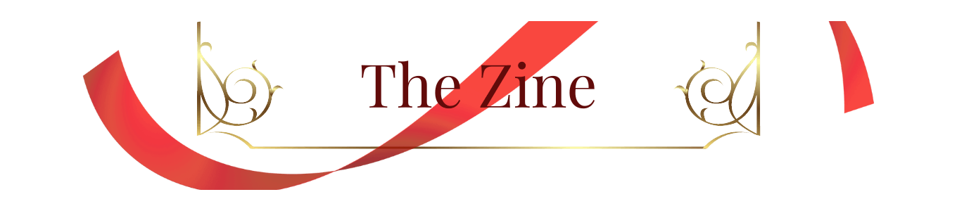 A digital rectangle-shaped banner with a red ribbon curved against a gold divider.  The word in the center, in a maroon-colored font, reads: “The Zine.”