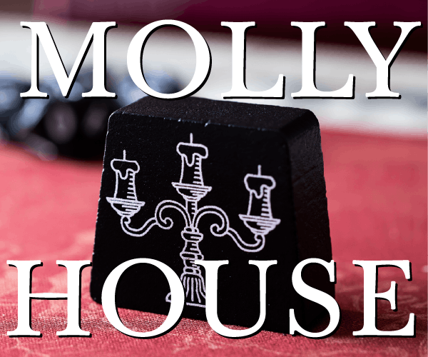 Molly House Candelabra Wooden Game Piece lifestyle photo with superimposed Molly House title text partially covering
