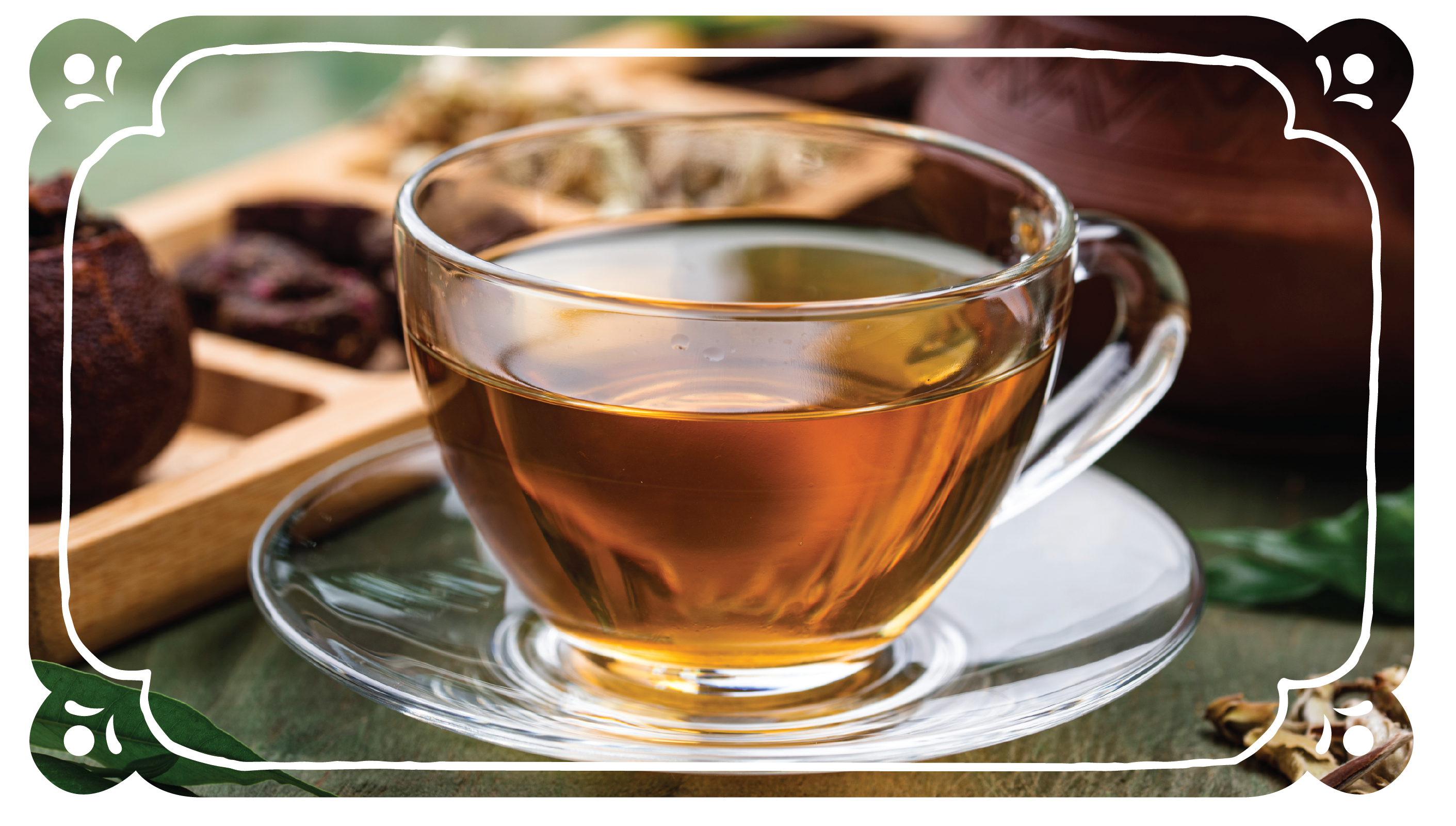 Amber colored tea in a clear tea cup