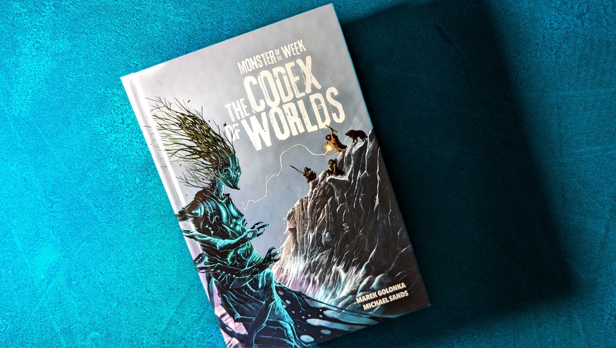 A copy of the Codex of Worlds casting a deep shadow against a bright teal background.