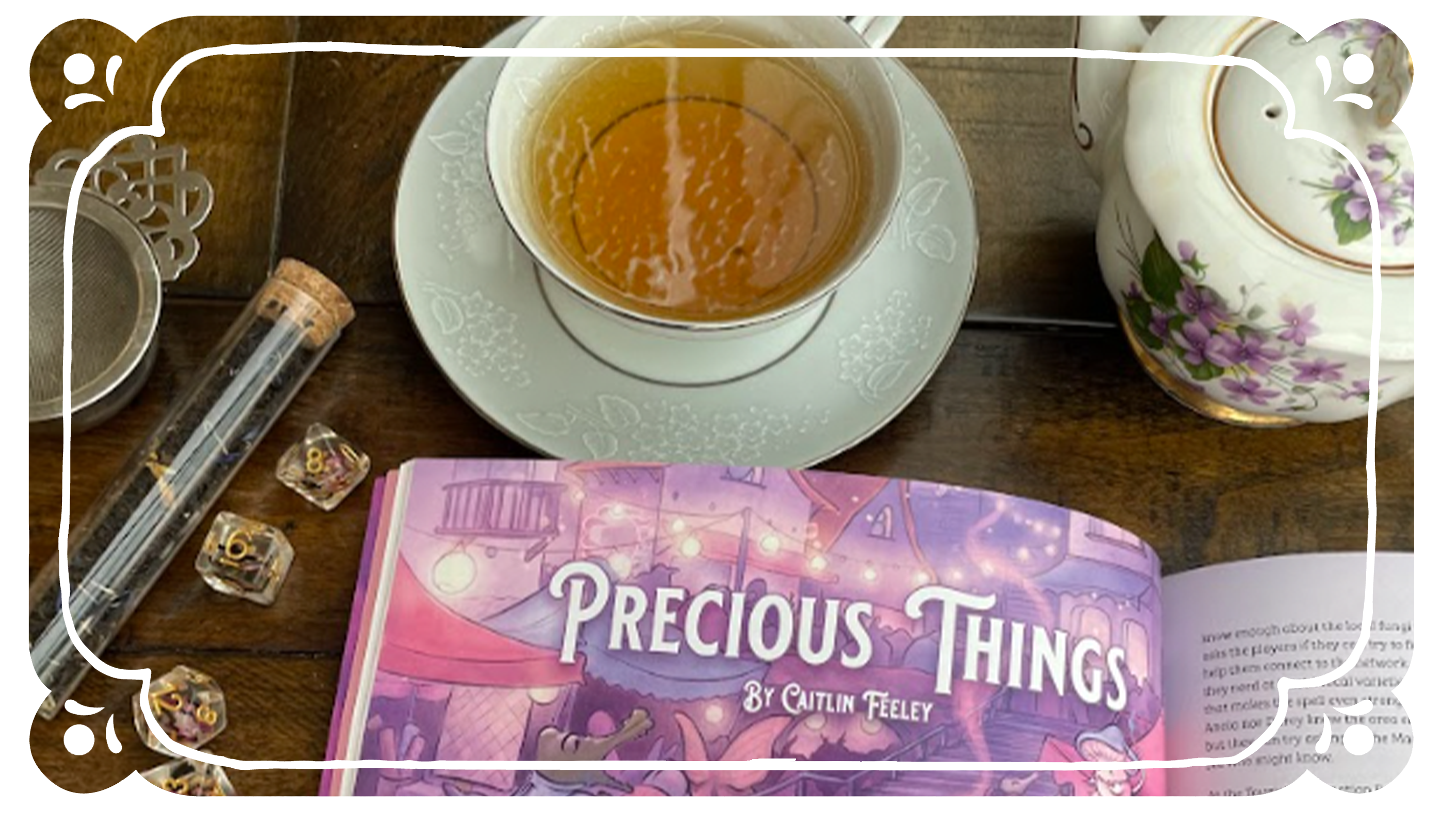 Cozy Companion open on a table surrounded by a tea setting