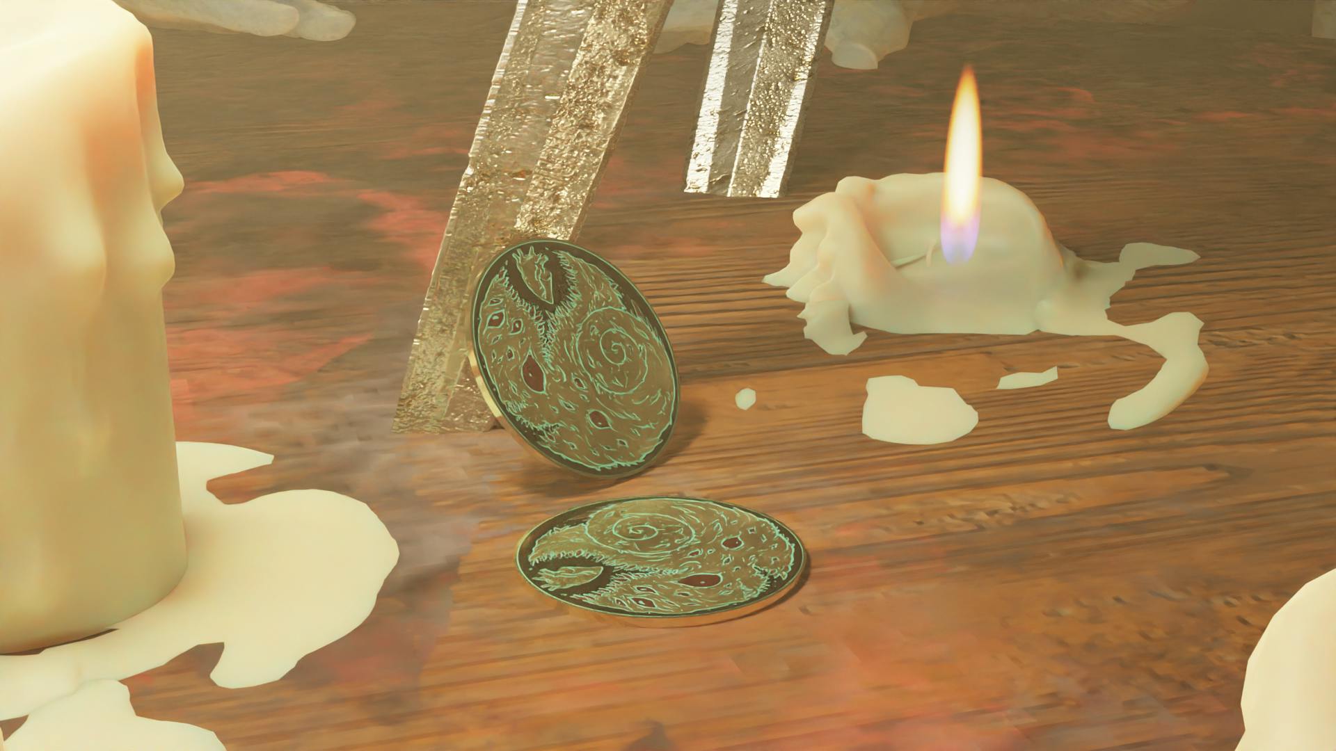 Two copies of the metal challenge coin sitting on a wooden table. The coin is brass and silvery metal, with a verdigris-colored inlay. The coin design shows a stylised entity about to devour a heart.