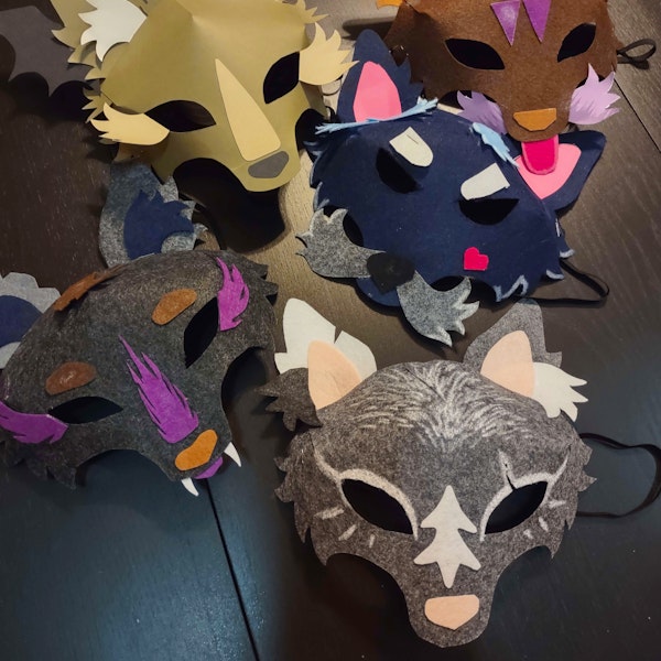 A photo of a mixed collection of wolf masks created during playtesting.