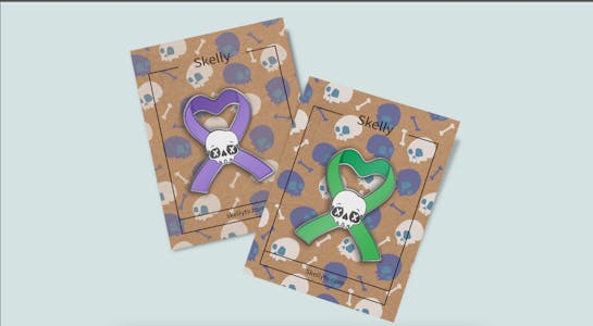 Skelly Enamel Ribbon Pin and Acrylic Standee