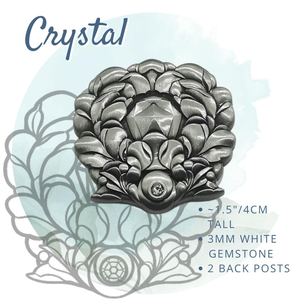 Crystal Pin: a floral design with a crystal in the center and a white gemstone near the base, the pin is 1.5"/4cm and has two back posts